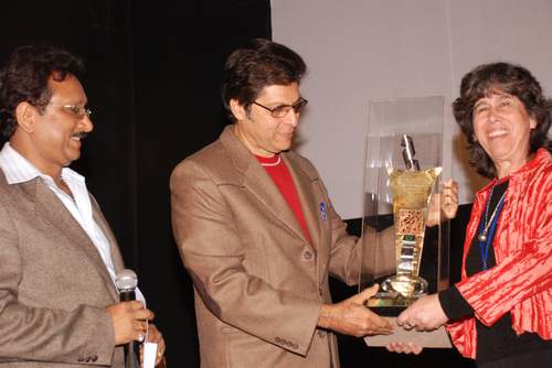 International filmmaker, Ms. Amira receiving an award from Vijendra Ghatge